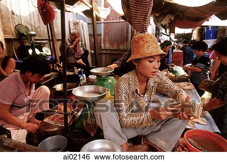 Cambodia, Phnom Penh, Cambodian woman counting money in market. View Large Photo Image Stock Photograph - Cambodia, Phnom Penh, Cambodian woman counting money in market.. Fotosearch