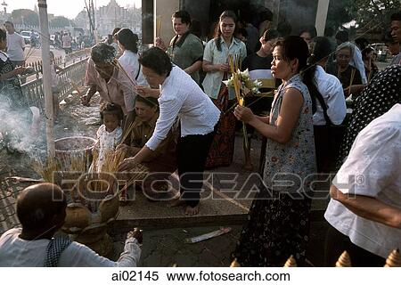 Cambodia, Phnom Penh, Cambodians make offerings at Buddhist temple. View Large Photo Image Stock Photography - Cambodia, Phnom Penh, Cambodians make offerings at Buddhist temple.. Fotosearch