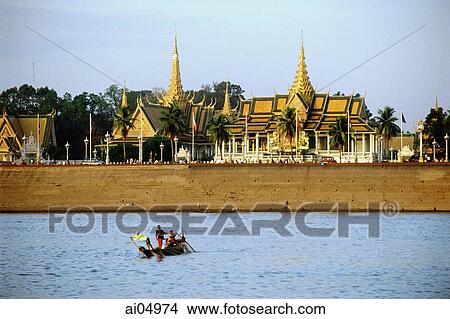 Cambodia, Phnom Penh, Tonle Sap River, Cham fisherman cross river with Royal palace and Silver Pagoda in background. View Large Photo Image Picture - Cambodia, Phnom Penh, Tonle Sap River, Cham fisherman cross river with Royal palace and Silver Pagoda in background.. Fotosearch