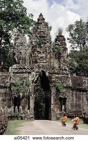 Cambodia, Siem Reap, Buddhist monks on motorcycles riding into Angkor View Large Photo Image Stock Image - Cambodia, Siem Reap, Buddhist monks on motorcycles riding into Angkor. Fotosearch