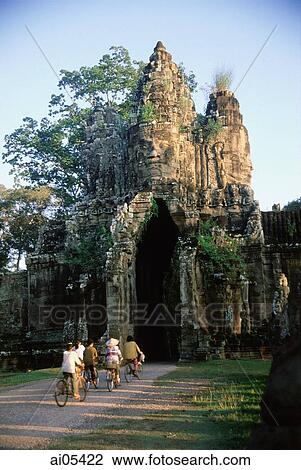Cambodia, Siem Reap, Villagers on bicycles ride into the South Gate entrance to Angkor View Large Photo Image Stock Image - Cambodia, Siem Reap, Villagers on bicycles ride into the South Gate entrance to Angkor. Fotosearch