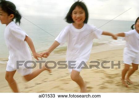 Children in white outfits running along the beach View Large Photo Image Stock Image - Children in white outfits running along the beach. Fotosearch