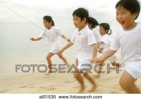 Children in white outfits running along the beach View Large Photo Image Stock Photography - Children in white outfits running along the beach. Fotosearch