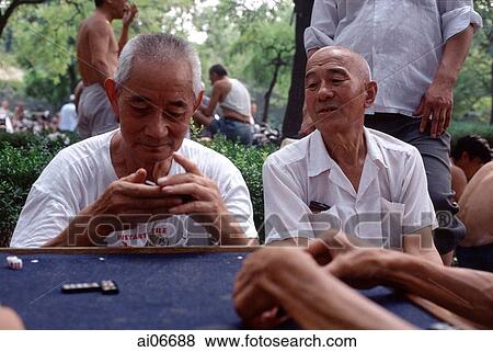China, Beijing, Old men playing traditional Chinese game View Large Photo Image Stock Photo - China, Beijing, Old men playing traditional Chinese game. Fotosearch