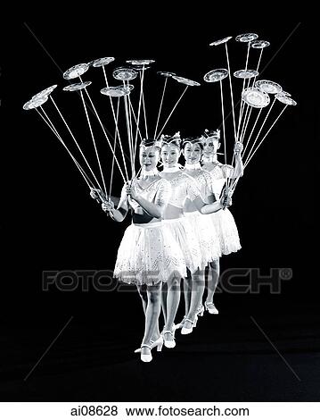 Stock Photo - China, Hong Kong, Acrobats of the Shenyang Acrobatic Troupe spinning plates on sticks. Fotosearch