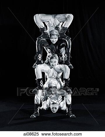 China, Hong Kong, Acrobats of the Shenyang Acrobatic Troupe performing balancing act View Large Photo Image Stock Photography - China, Hong Kong, Acrobats of the Shenyang Acrobatic Troupe performing balancing act. Fotosearch