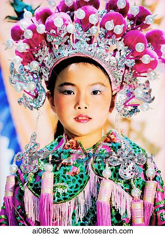 China, Hong Kong, Cheung Chau Island, Portrait of girl, 9, wearing a traditional costume during the Bun Festival procession in 2000 View Large Photo Image Stock Image - China, Hong Kong, Cheung Chau Island, Portrait of girl, 9, wearing a traditional costume during the Bun Festival procession in 2000. Fotosearch