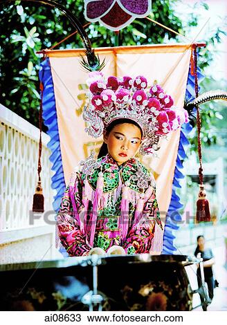 China, Hong Kong, Cheung Chau Island, Portrait of girl, 9, standing on a float, wearing a traditional costume during the Bun Festival procession in 2000 View Large Photo Image Stock Image - China, Hong Kong, Cheung Chau Island, Portrait of girl, 9, standing on a float, wearing a traditional costume during the Bun Festival procession in 2000. Fotosearch