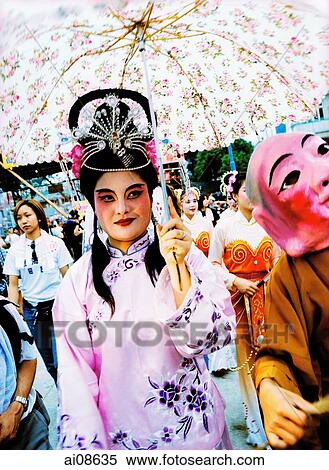 China, Hong Kong, Cheung Chau Island, Portrait of a woman wearing a traditional costume during the Bun Festival procession in 2000 View Large Photo Image Stock Photography - China, Hong Kong, Cheung Chau Island, Portrait of a woman wearing a traditional costume during the Bun Festival procession in 2000. Fotosearch