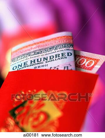 Stock Image - China, Hong Kong, Hong Kong dollar in red packet. Fotosearch