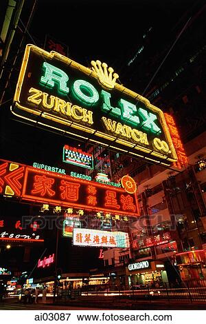 Stock Photo - China, Hong Kong, Kowloon, Neon signs on Nathan Road at night. Fotosearch