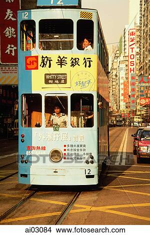 Picture - China, Hong Kong, Wanchai, Trams in traffic. Fotosearch