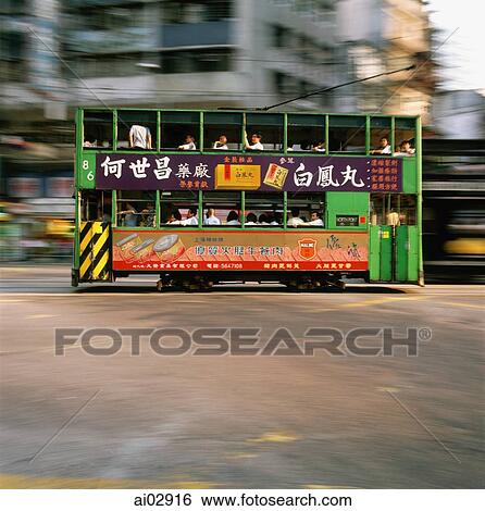 China, Hong Kong, Wanchi, Tram in motion View Large Photo Image Stock Photograph - China, Hong Kong, Wanchi, Tram in motion. Fotosearch