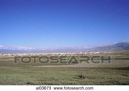 Stock Image - China, Szechuan (Sichuan), Kham region, Nomad tent cities sprinkle the countryside, signaling another Kham festival gathering.. Fotosearch