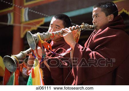 Stock Image - China, Szechuan (Sichuan), Kham region, Monks playing horns during monastery festival.. Fotosearch
