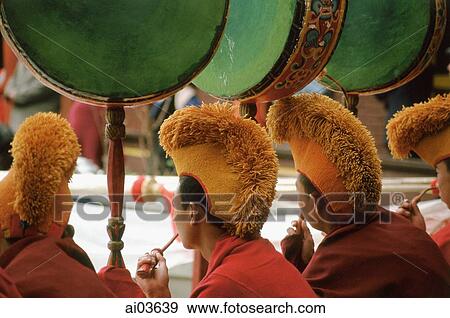Stock Photo - China, Szechuan (Sichuan), Kham region, Monks playing drums at Temple Puja.. Fotosearch