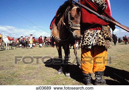 China, Szechuan (Sichuan), Kham region, A costumed Khampa man stands with his horse at the summer nomad festival. View Large Photo Image Stock Photo - China, Szechuan (Sichuan), Kham region, A costumed Khampa man stands with his horse at the summer nomad festival.. Fotosearch