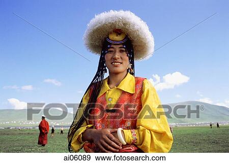 China, Szechuan (Sichuan), Kham region, Khampa woman wearing traditional hat, goatskin and brocade at Nomad festival. View Large Photo Image Stock Photo - China, Szechuan (Sichuan), Kham region, Khampa woman wearing traditional hat, goatskin and brocade at Nomad festival.. Fotosearch