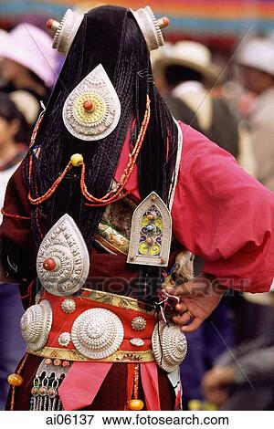 China, Szechuan (Sichuan), Kham region, Nomad costume, hair decorations which includes large belts and silver pendants in plaited hair. View Large Photo Image Stock Photo - China, Szechuan (Sichuan), Kham region, Nomad costume, hair decorations which includes large belts and silver pendants in plaited hair.. Fotosearch
