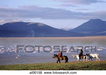 Stock Photo - China, Szechuan (Sichuan), Kham region, Summer nomad festival, horseman in early morning near tent city.. Fotosearch