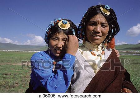 China, Szechuan (Sichuan), Kham region, Nomad girls in traditional decorations of turquoise and coral View Large Photo Image Stock Photograph - China, Szechuan (Sichuan), Kham region, Nomad girls in traditional decorations of turquoise and coral. Fotosearch