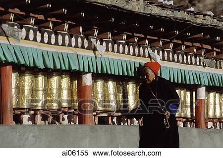 China, Szechuan (Sichuan), Kham region, Tibetan woman making kora with prayer wheels. View Large Photo Image Stock Photography - China, Szechuan (Sichuan), Kham region, Tibetan woman making kora with prayer wheels.. Fotosearch