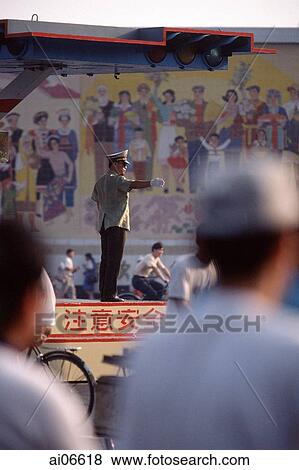 Chinese soldier directing traffic, Beijing View Large Photo Image Stock Photo - Chinese soldier directing traffic, Beijing. Fotosearch