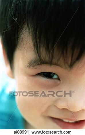 Close-up of young boy View Large Photo Image Stock Image - Close-up of young boy. Fotosearch