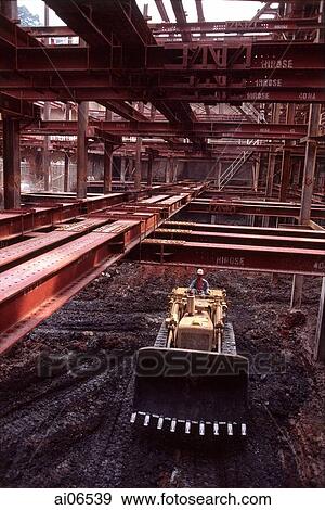 Construction site, man operating bulldozer View Large Photo Image Stock Photo - Construction site, man operating bulldozer. Fotosearch