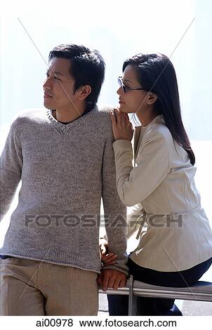 Couple by waterfront, looking away View Large Photo Image Stock Photo - Couple by waterfront, looking away. Fotosearch