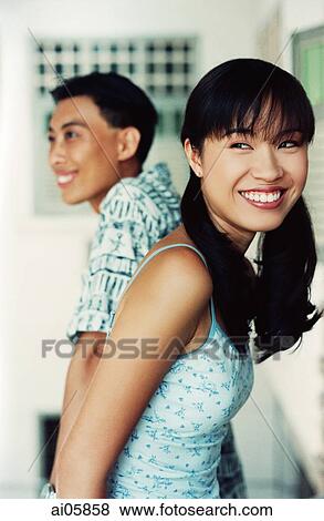 Stock Photo - Couple facing away from each other. Fotosearch