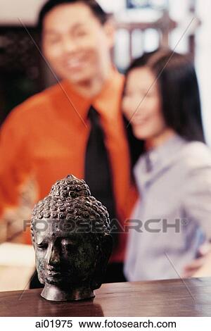 Couple in antique store, statue of Buddha in foreground View Large Photo Image Stock Photography - Couple in antique store, statue of Buddha in foreground. Fotosearch