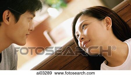 Couple looking at each other View Large Photo Image Stock Photo - Couple looking at each other. Fotosearch