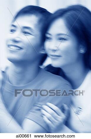 Couple looking off camera (motion blur) View Large Photo Image Stock Image - Couple looking off camera (motion blur). Fotosearch