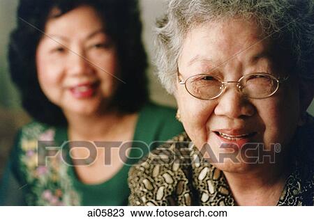 Elderly woman with prime woman in background, portrait View Large Photo Image Stock Image - Elderly woman with prime woman in background, portrait. Fotosearch