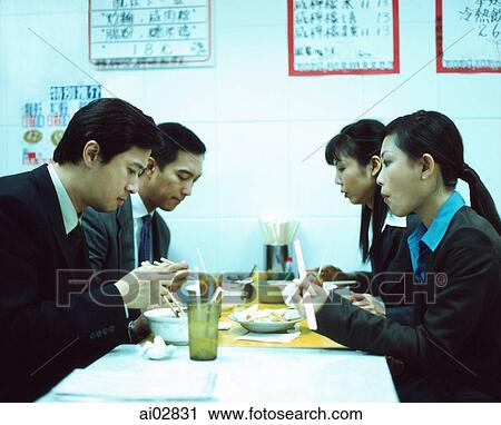 Executive eating at chinese restaurant. View Large Photo Image Stock Image - Executive eating at chinese restaurant.. Fotosearch