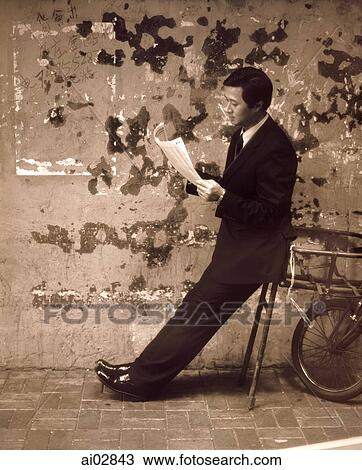 Executive leaning on bicycle rack reading stock report. View Large Photo Image Stock Image - Executive leaning on bicycle rack reading stock report.. Fotosearch