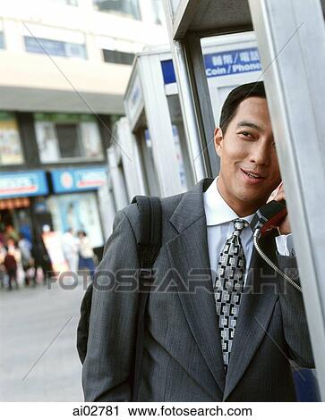 Executive on public telephone. View Large Photo Image Stock Image - Executive on public telephone.. Fotosearch