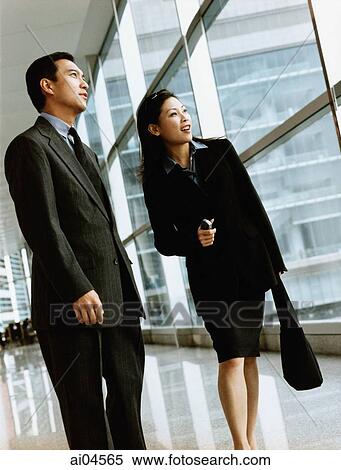 Executive pair looking out window. View Large Photo Image Stock Photography - Executive pair looking out window.. Fotosearch