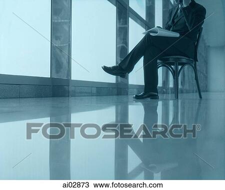 Executive sitting using cellular phone next to window, head not shown. View Large Photo Image Stock Image - Executive sitting using cellular phone next to window, head not shown.. Fotosearch