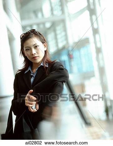 Executive woman leaning on rail, portrait. View Large Photo Image Stock Image - Executive woman leaning on rail, portrait.. Fotosearch