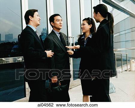 Executives meeting outside building. View Large Photo Image Stock Image - Executives meeting outside building.. Fotosearch