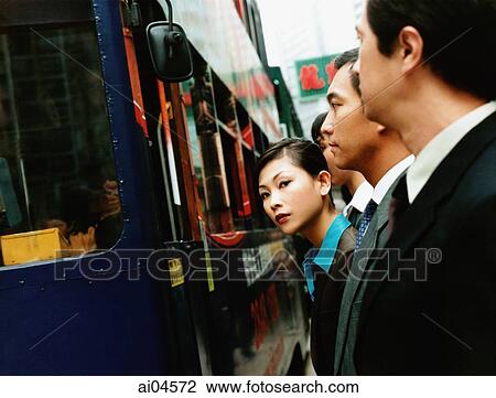 Executives waiting for bus, female executive looking at camera. View Large Photo Image Stock Image - Executives waiting for bus, female executive looking at camera.. Fotosearch