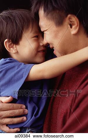 Father and son hugging each other View Large Photo Image Picture - Father and son hugging each other. Fotosearch