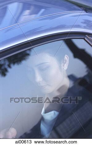 Female executive in car View Large Photo Image Stock Image - Female executive in car. Fotosearch