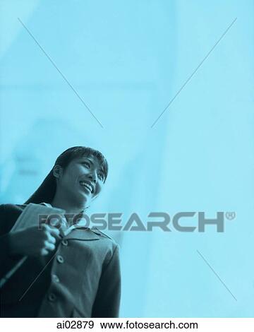 Female executive looking off, building in background. View Large Photo Image Stock Photo - Female executive looking off, building in background.. Fotosearch