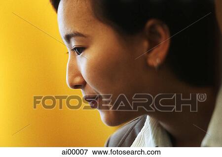 Female executive, profile, yellow background View Large Photo Image Stock Photo - Female executive, profile, yellow background. Fotosearch