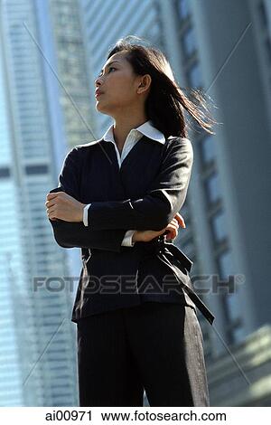 Female executive standing, profile View Large Photo Image Stock Image - Female executive standing, profile. Fotosearch