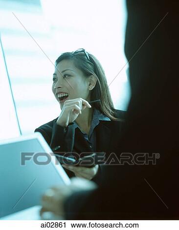 Female executive using PDA and talking. View Large Photo Image Stock Image - Female executive using PDA and talking.. Fotosearch