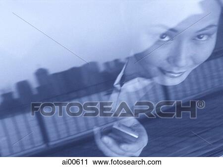 Female executive with cellular phone, skyline reflected in car window View Large Photo Image Stock Image - Female executive with cellular phone, skyline reflected in car window. Fotosearch